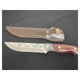hammered-finish steel blade with an etched cloud