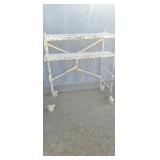 Small scaffold on wheels sheet rock plaster