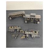 Three collectible cast iron train cars. The