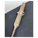 an antique hand-pump vacuum cleaner