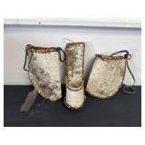 three handmade rustic wall pockets and pouches
