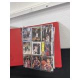 Red binder of basketball cards