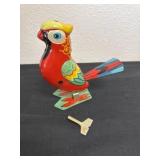 Vintage, jumping parrot with winding key with
