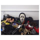 Box of Halloween masks, wigs costume parts and