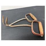 Two antique hay hook