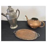 Copper teapot with silver on copper tray and