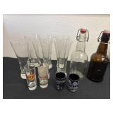 Group of drinking glasses with shot glasses, and