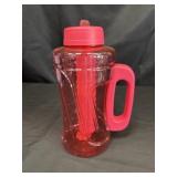 Large red plastic water bottle