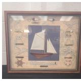 This is a framed nautical shadow box featuring a