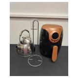 Copper chef air fryer looks used with tea, pot,