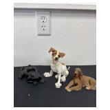 Two dog figurines with frog figurines