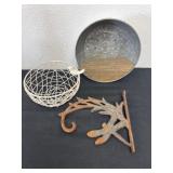Metal basket with bird, metal wall, hanging, and