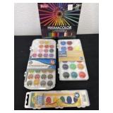 Group of watercolors and colored pencils