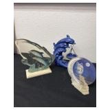 2 dolphin figurine with wolf figurine