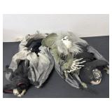 Two Halloween bats with hanging skull