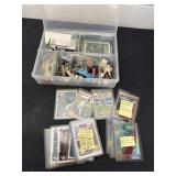 Group of baseball cards with baseball figurines