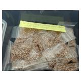 16 bags of rose gold colored jump rings