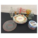 Group or Coca Cola glasses and plates and tin