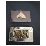 western-style belt buckle with a gold-tone horse