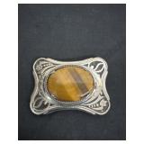 vintage western belt buckle features an ornate
