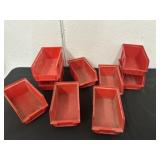 Group of Red Plastic Organizer Boxes