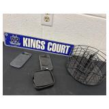 King Court signs with cell phones, coaster, and a