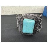 striking silver-tone cuff bracelet features a
