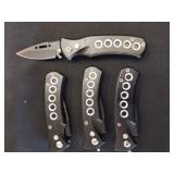 Four new spring loaded 2 inch pocket knives