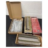 Box of new drawer poles with a D finish Nails