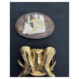 belt buckle is a vintage gold-tone western design