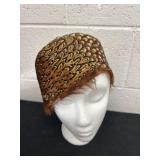 cloche hat crafted from layered brown and tan
