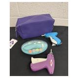 Tag guns with nail shaver and purple bag