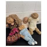 3 Cabbage Patch dolls with baby doll
