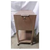 vintage metal filing cabinet on wheels