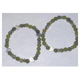 0Bracelet pair; Green beads w/silver tone hearts