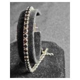 Sterling Silver tennis bracelet w/dark red stones