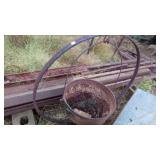 2 CAST IRON POTS 1-24", 1-22" W/METAL HOOP STAND