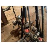 Assorted fishing poles & animal trap