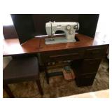 Sew Mor Sewing Machine in Cabinet-powers on
