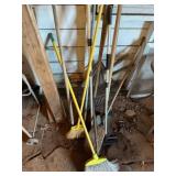 Assorted yard tools, brooms, shovel, rake