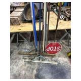 4 Metal rakes & stop sign