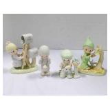 4 Precious moments figurines