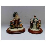 2 Dept 56 resin Christmas figurines on bases