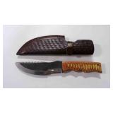 Damascus steel hunting knife with sheath.