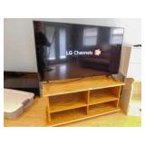LG  48" Flatscreen TV on base with remote,TV Stand