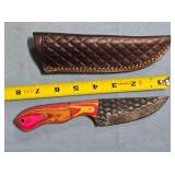 Straight blade knife w/two tone wood handle.