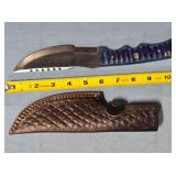 Straight blade hunting knife w/serrated blade.