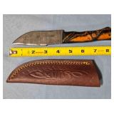 Drop point blade knife w/spine jimping.