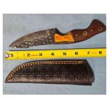 Drop point knife w/sharpening coil.