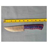 Drop point blade knife. Carved wood handle.